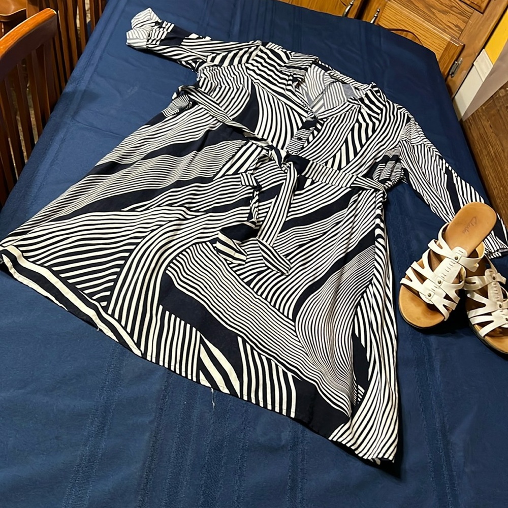 100% rayon dress with optional belt/sash. Perfect for in between seasons.